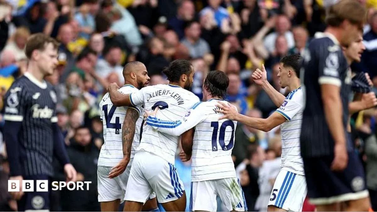 Players celebrating a goal during a match