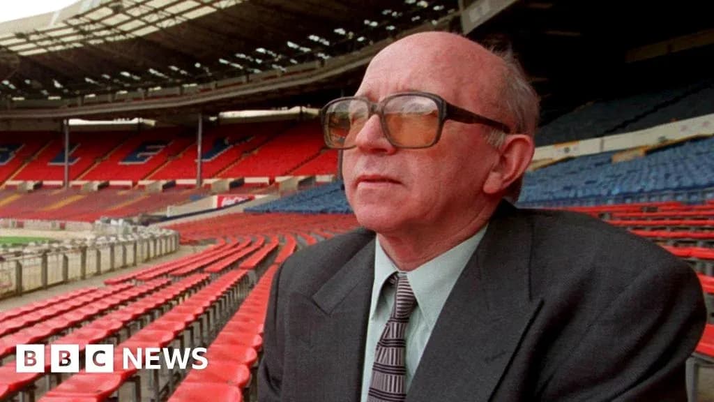 Man sitting in empty stadium stands at Wembley