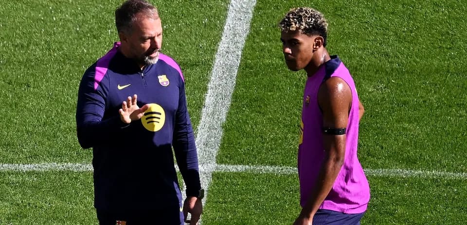 Coach talking to player during training session
