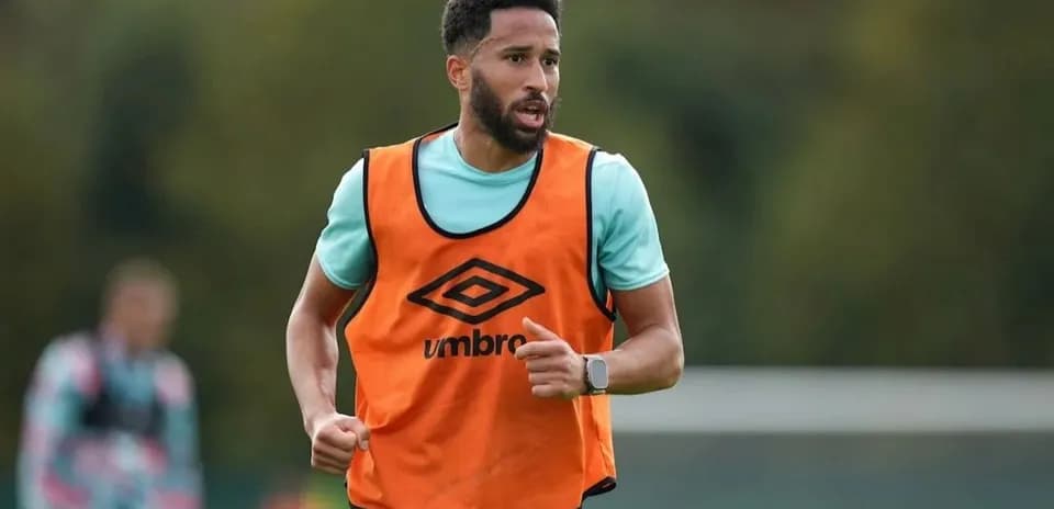 Player running during training session in orange bib