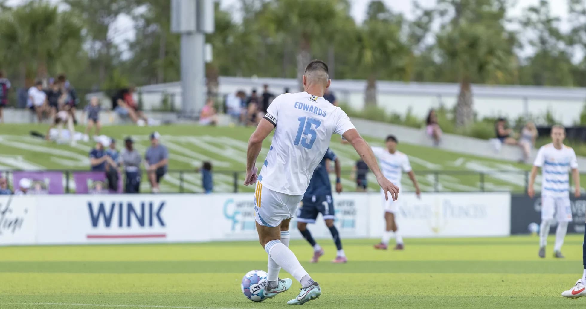 Player taking a free kick during match