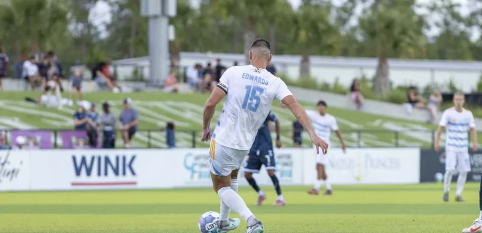 Player taking a free kick during match