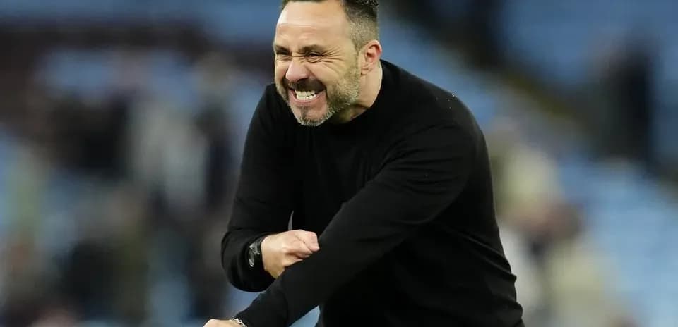 Coach celebrating enthusiastically during a match