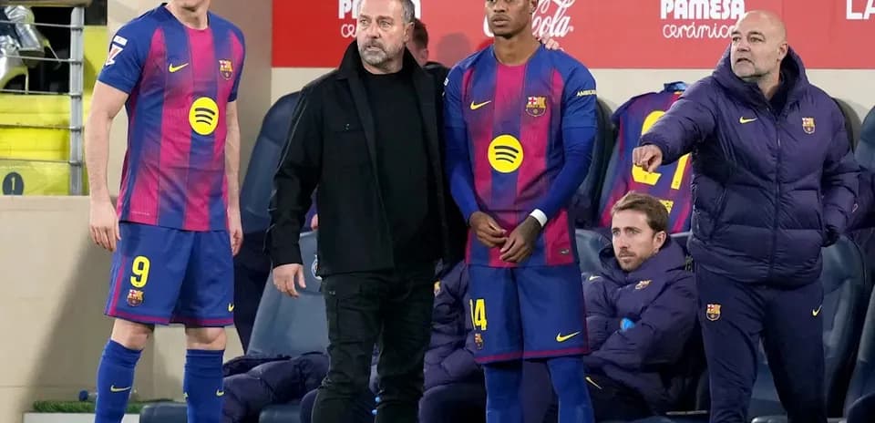 Barcelona players and staff during match substitution