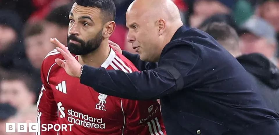 Player receiving tactical instructions from coach on sideline