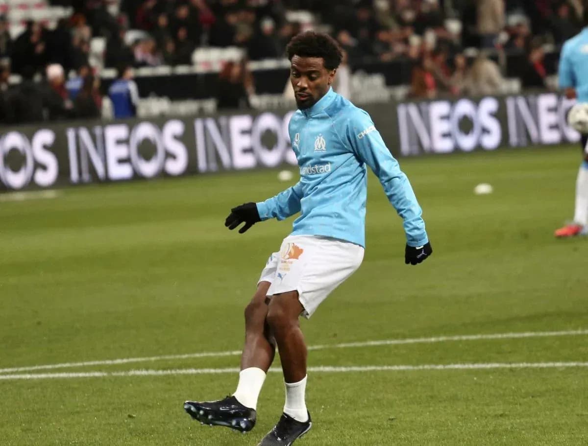 Player warming up on pitch before match