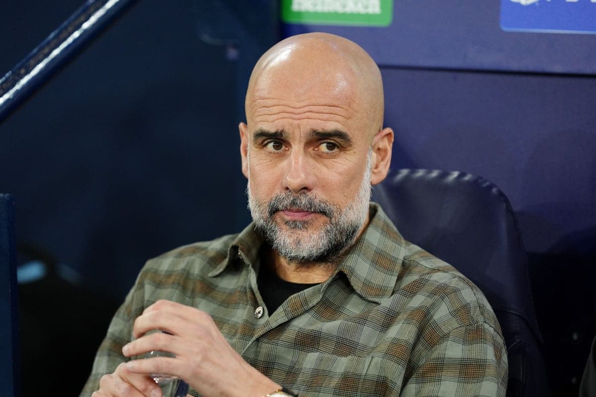 Coach sitting on bench during match preparation