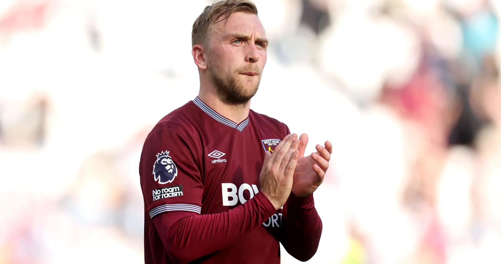 West Ham player applauding fans during match
