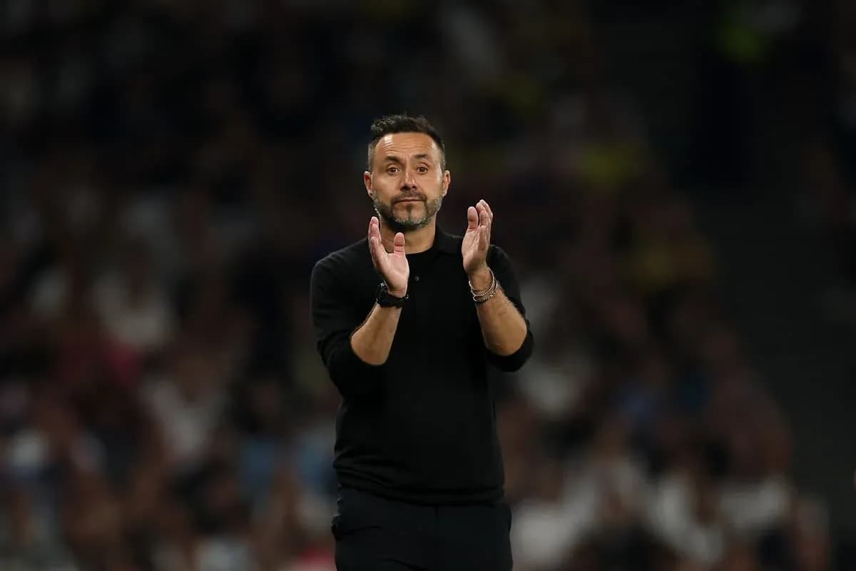 Coach applauding during a match on the sidelines