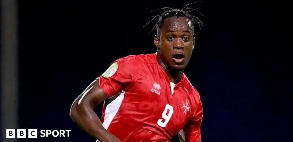 Player in red jersey during a football match