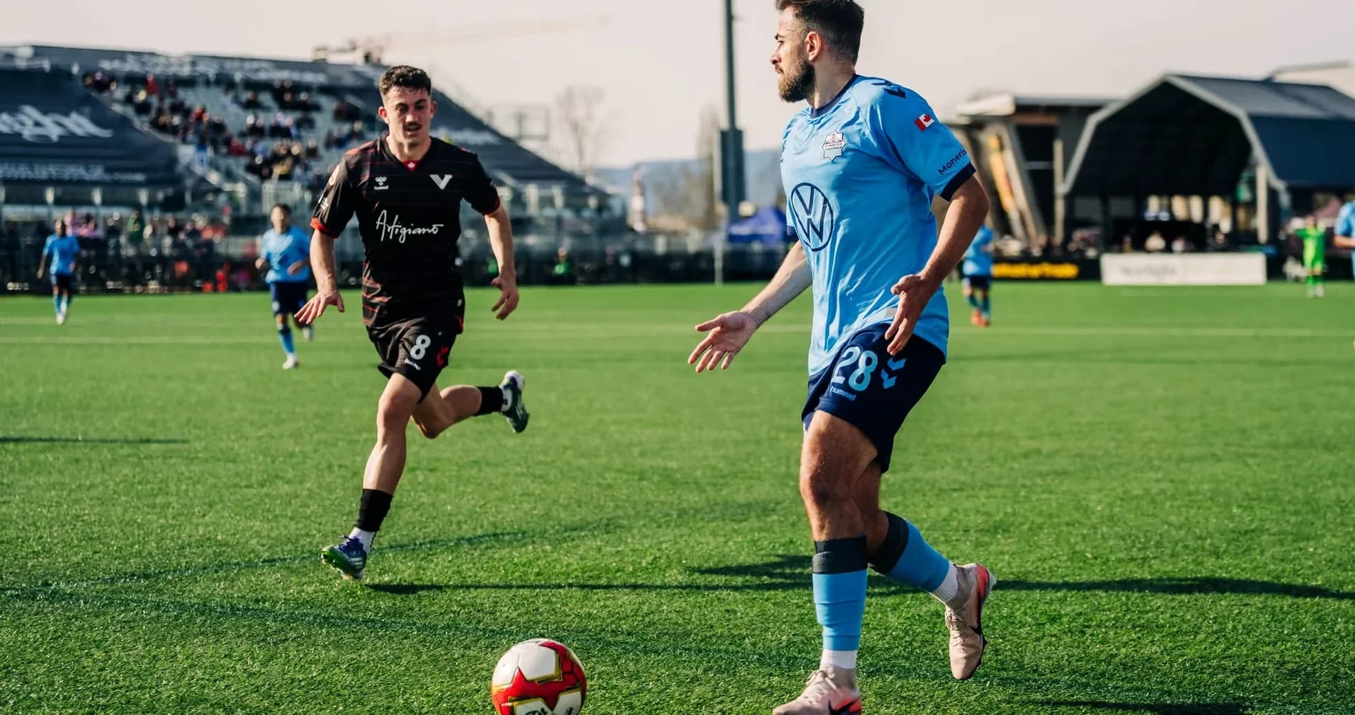Player dribbling ball during HFX Wanderers match