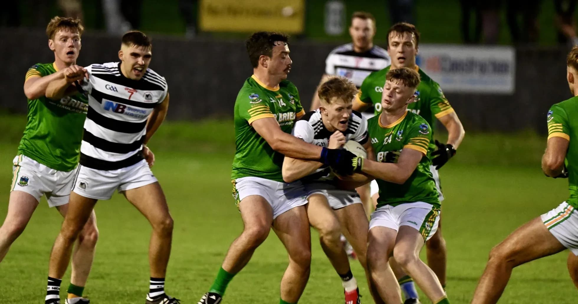 Players competing for the ball during a Gaelic football match