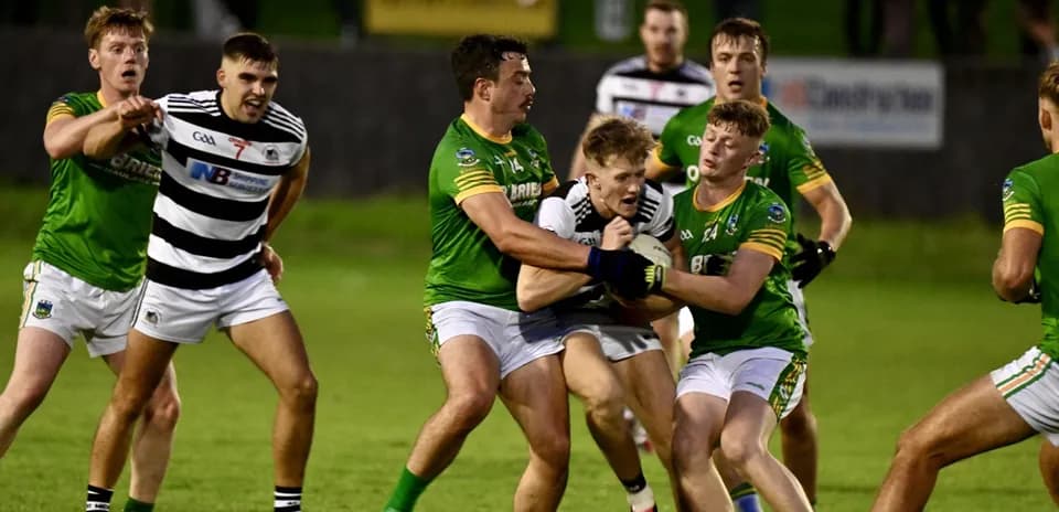Players competing for the ball during a Gaelic football match