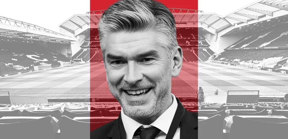 Person smiling in front of a football stadium