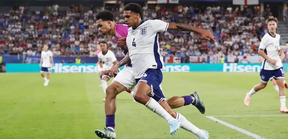 Two players competing for the ball during match