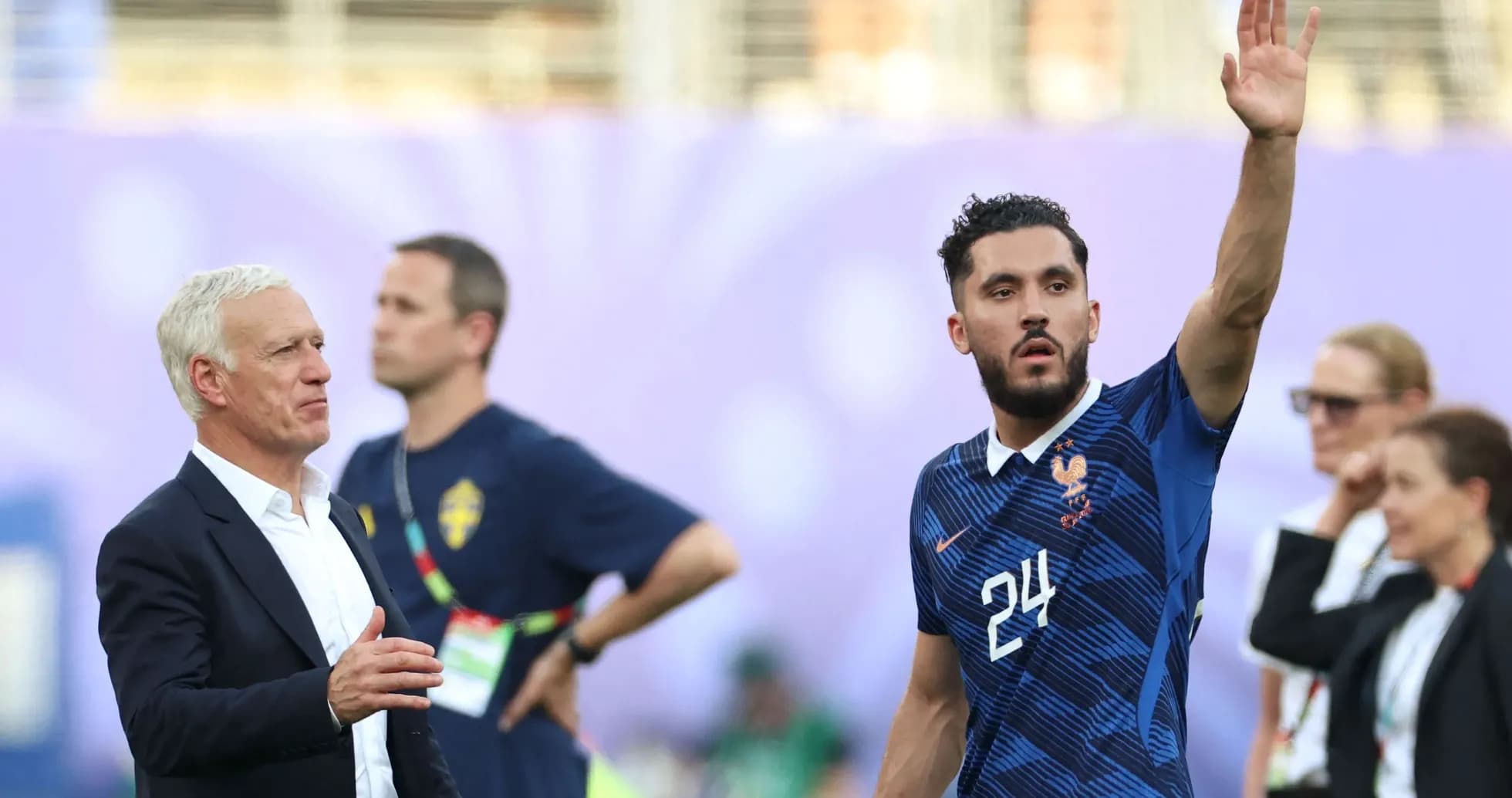 France coach and player during match interaction