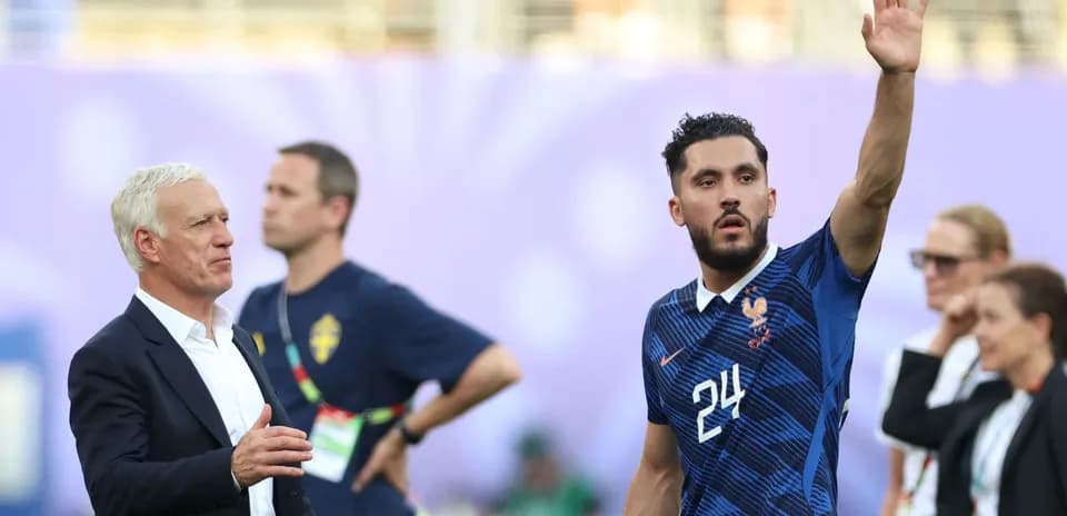 France coach and player during match interaction