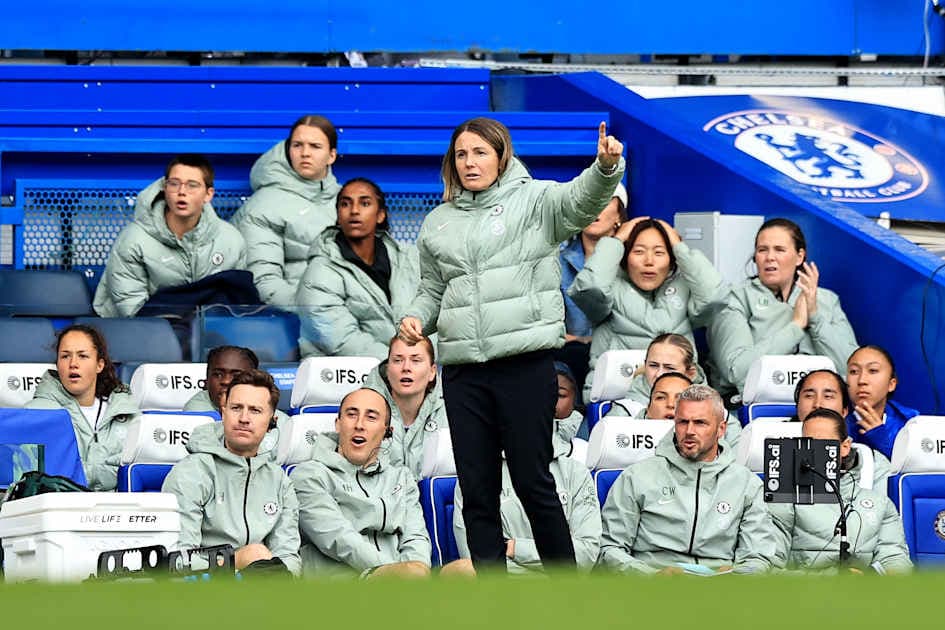 Coach directing players from the sidelines during match