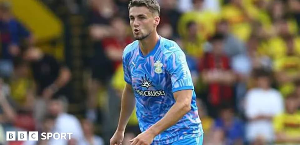 Player in blue kit during match action