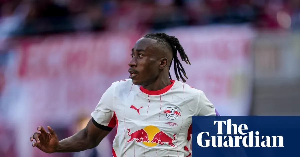 Player running during a match wearing RB Leipzig kit