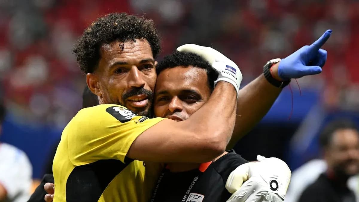 Goalkeeper celebrating with coach after match