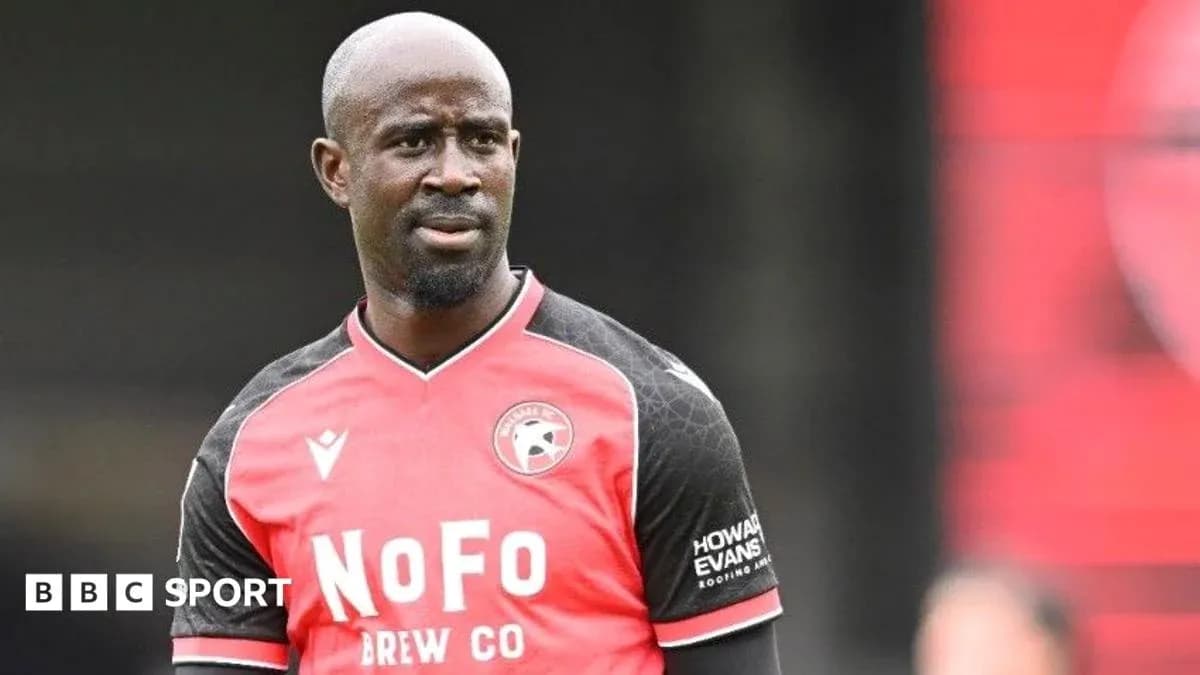 Player in red and black jersey on the field