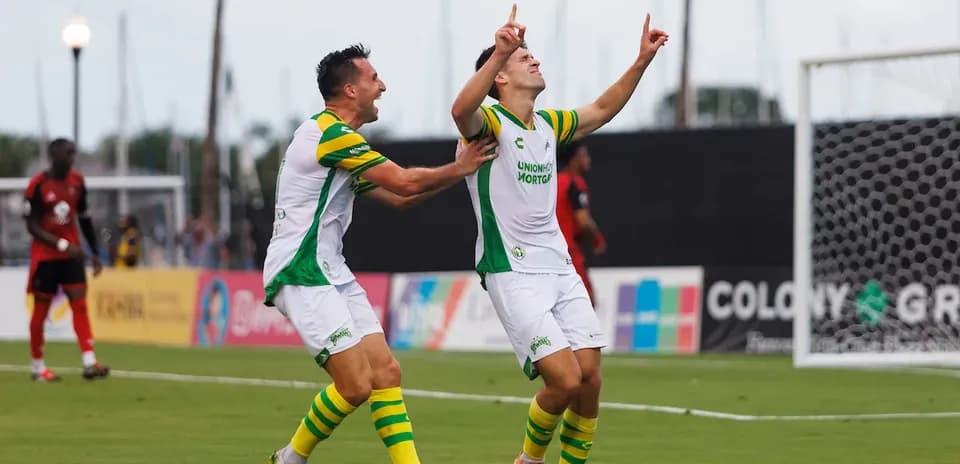Players celebrating a goal in USL Championship match