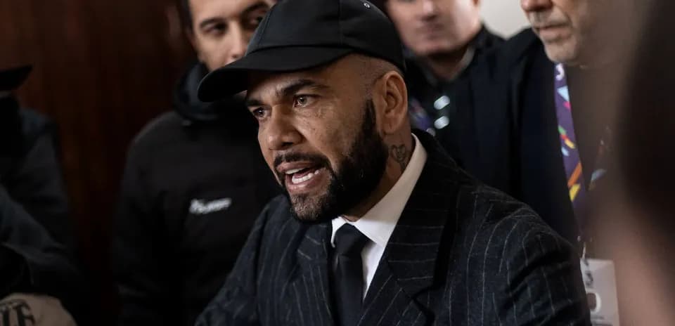 Man speaking to crowd in formal attire