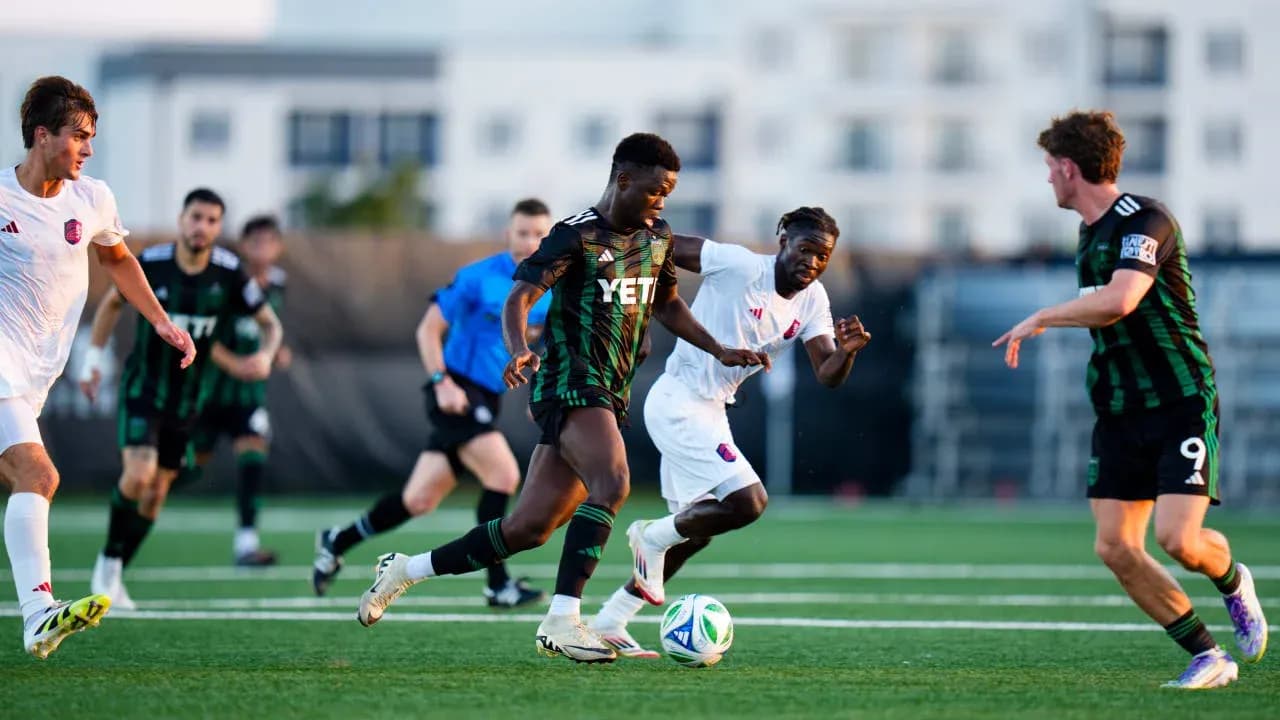 Players competing for the ball during MLS Next Pro match