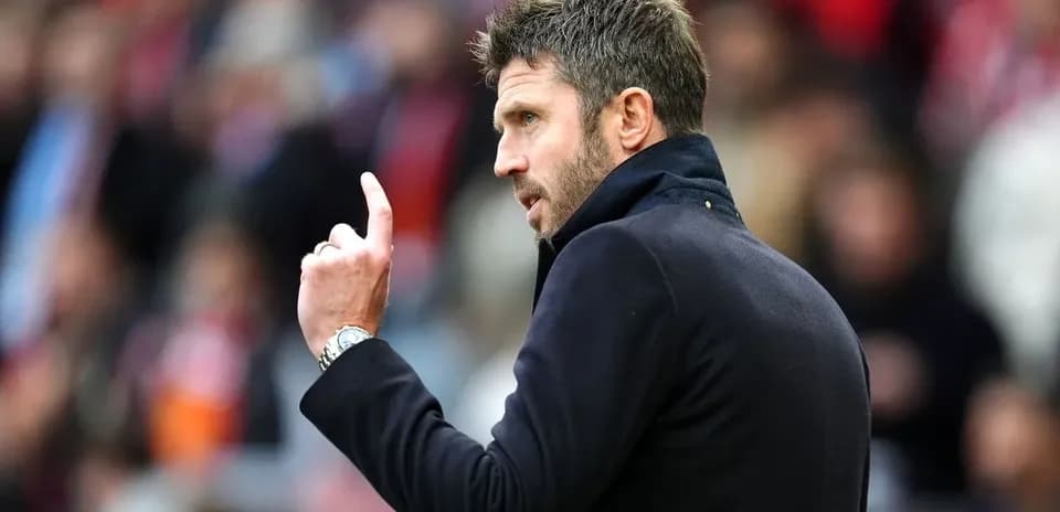 Coach gesturing during a match on the sidelines