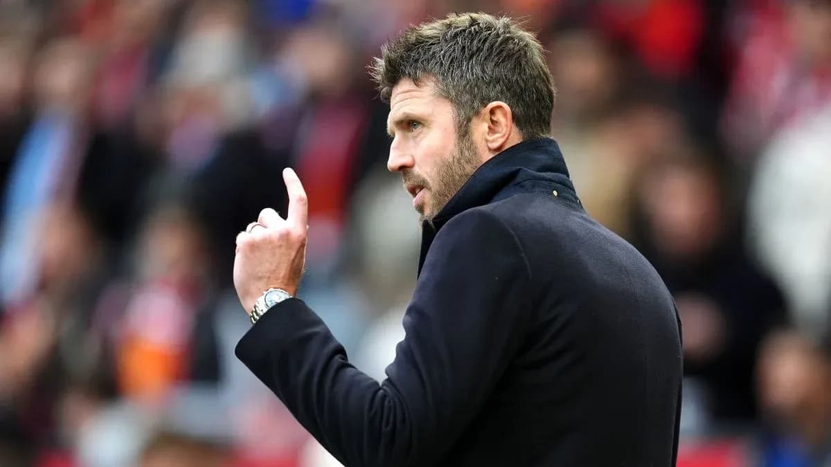 Coach gesturing during a match on the sidelines