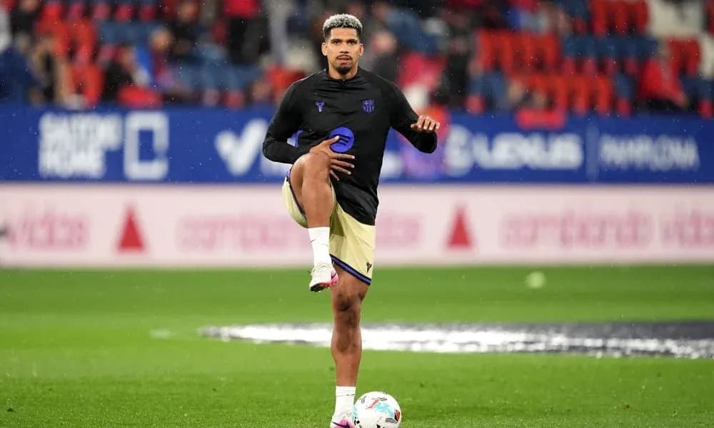 Player stretching during warm-up on the pitch