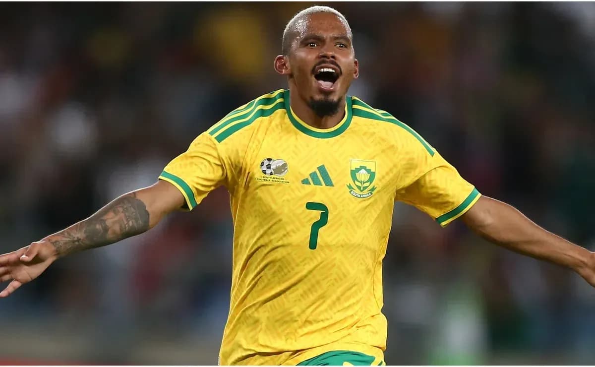 Player celebrating goal in yellow South Africa jersey