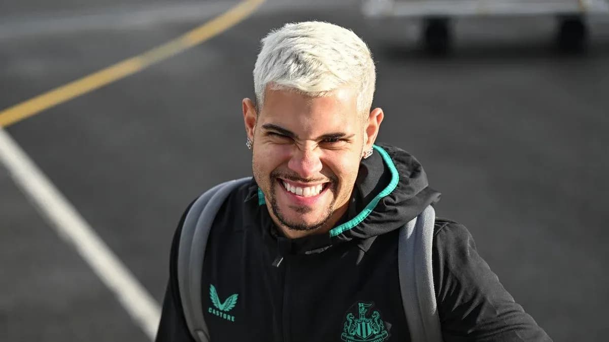 Player smiling while wearing Newcastle training jacket