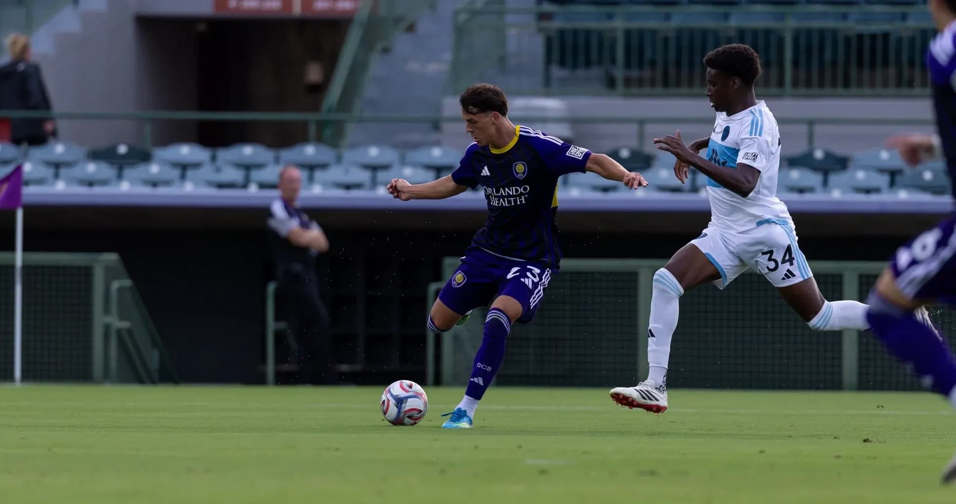 Player dribbling the ball during Orlando City II match