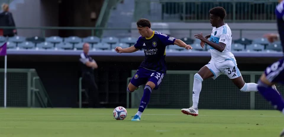 Player dribbling the ball during Orlando City II match
