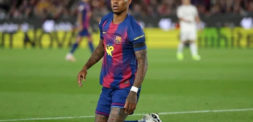 Barcelona player kneeling on pitch during match