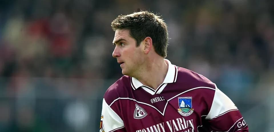 Player in maroon jersey during a match action