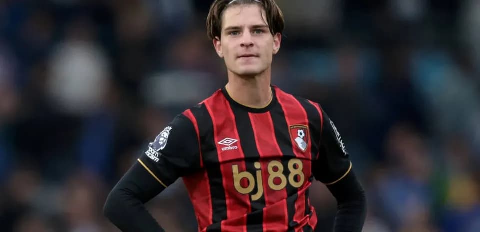 Bournemouth player in black and red jersey during match