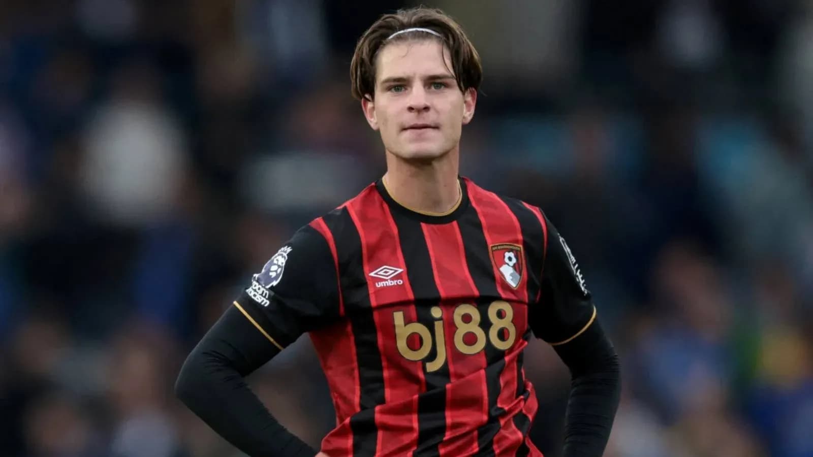 Bournemouth player in black and red jersey during match