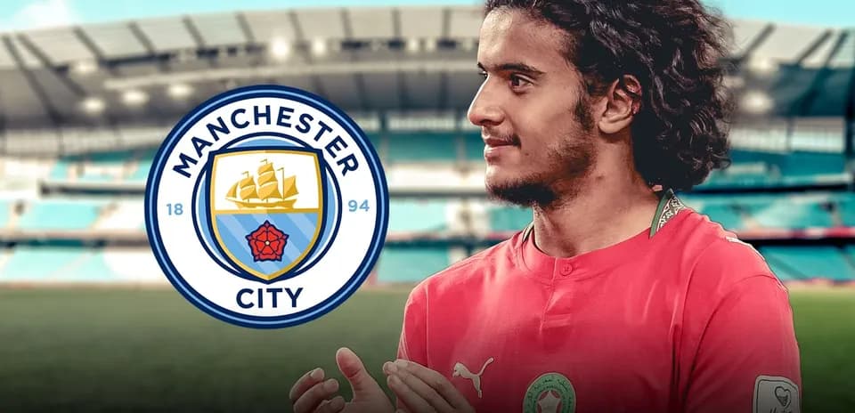 Player in red jersey with Manchester City logo