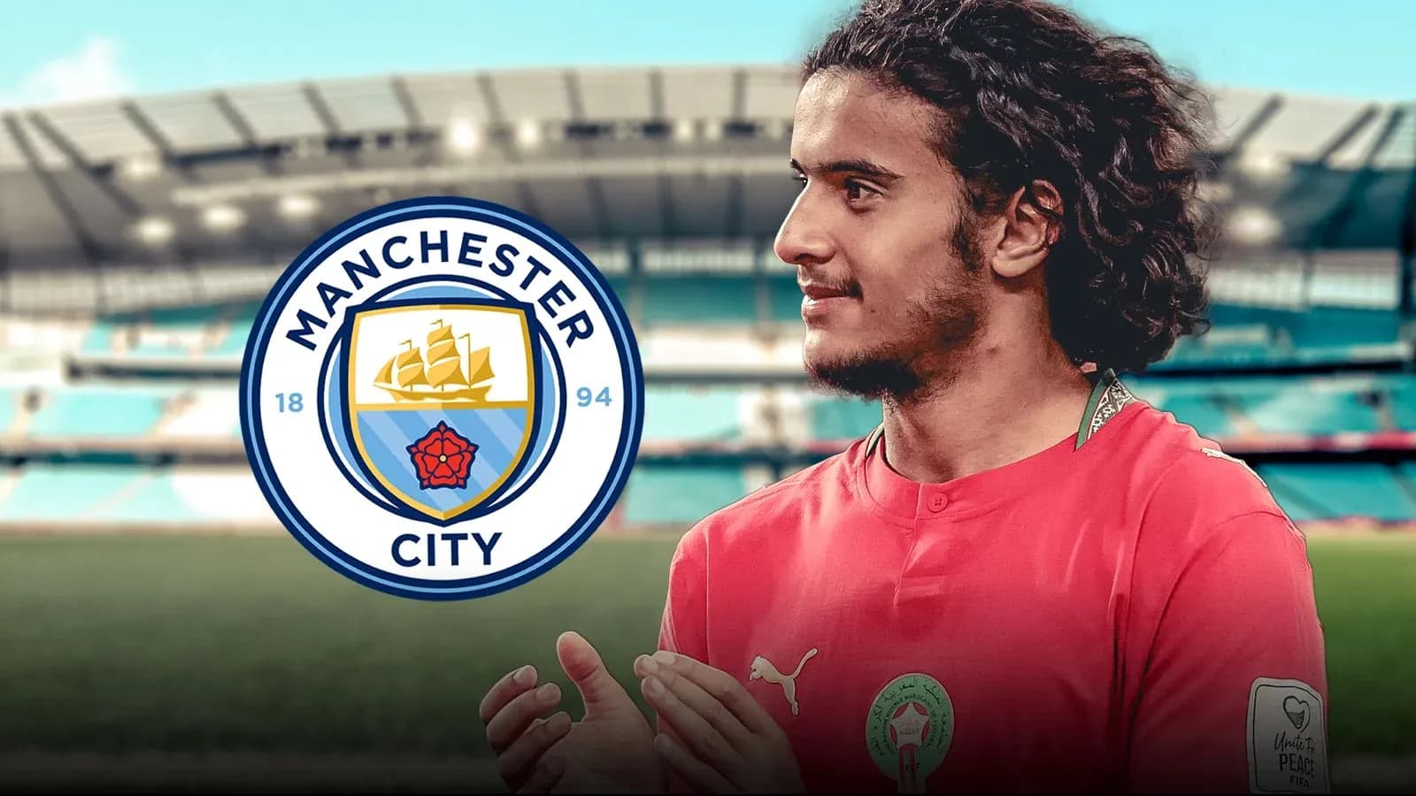 Player in red jersey with Manchester City logo