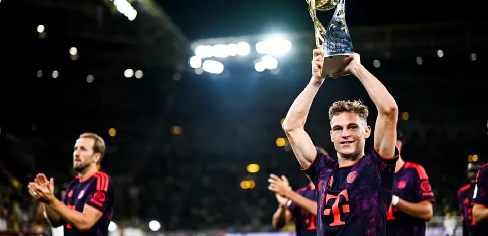 Player celebrating with trophy after match victory