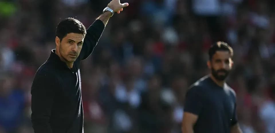 Manager gesturing during a match from the sideline