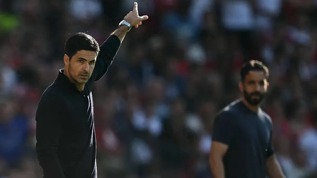 Manager gesturing during a match from the sideline