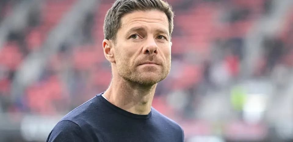Coach on field during match warm-up