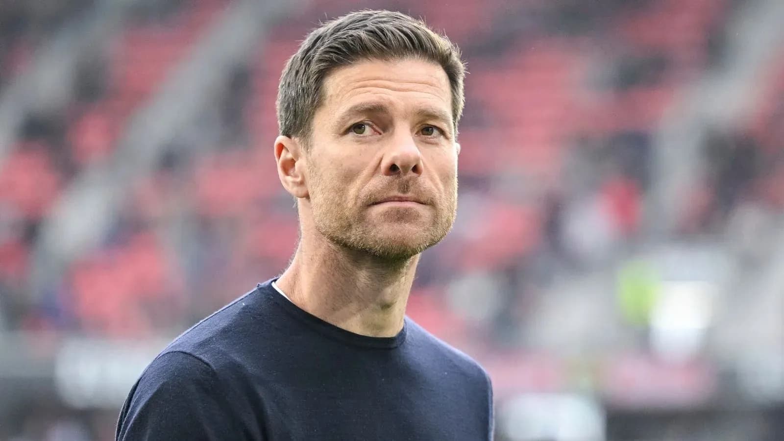 Coach on field during match warm-up