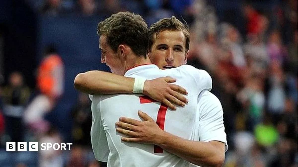 Two players embracing on the field after a match
