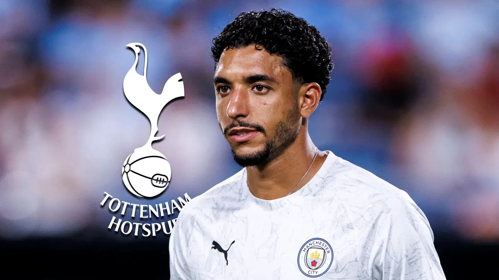 Player in Manchester City kit with Tottenham logo