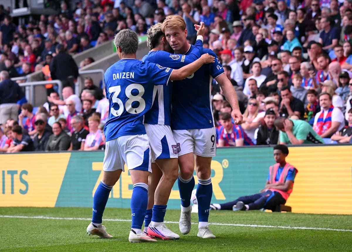 Players celebrating a goal during a match